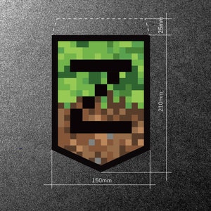May include: A green and brown Minecraft-themed patch with a black outline. The patch is shaped like a shield and measures 6 inches wide by 8.25 inches tall.
