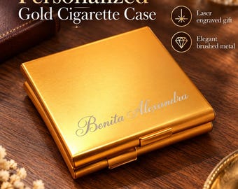 May include: A square gold cigarette case with a brushed metal finish. The front features the laser-engraved name Benita Alexandra in a cursive script. The text Personalized Gold Cigarette Case, Laser engraved gift, and Elegant brushed metal appear.