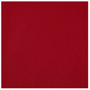 May include: Solid red fabric with a slightly textured surface. The color is a deep, rich shade of red, filling the entire frame. The fabric appears to be a single piece, with no visible patterns or designs.