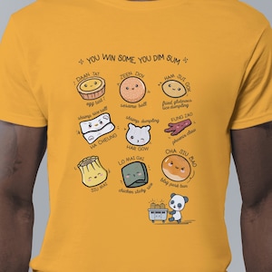 May include: A yellow t-shirt with a graphic of various dim sum dishes and the text "You win some you dim sum".