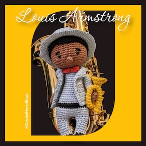 May include: A crocheted doll of Louis Armstrong, wearing a light blue suit, hat, and a red bow tie, holding a trumpet. The doll is set against a golden saxophone and a yellow and black background. The text "Louis Armstrong" is at the top.