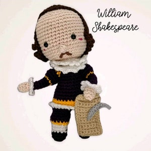 May include: A handmade crochet doll of William Shakespeare, featuring a tan face, brown hair, and a white ruffled collar. The doll wears a dark purple outfit with yellow and white accents and holds a tan scroll. The text "William Shakespeare" is written in cursive.