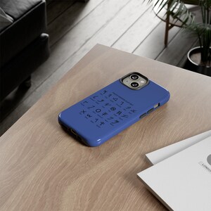 May include: A blue phone case with a white design of the Paleo Hebrew alphabet. The text reads "Paleo Hebrew Alpha Bet".