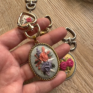 Hand embroidered keychain with heart shaped clips