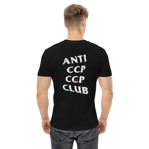 Puede incluir: Camiseta negra con texto blanco que dice "ANTI CCP CCP CLUB" en la espalda.