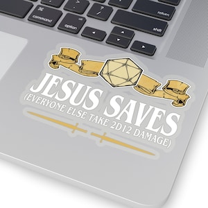 May include: A white sticker with the text "JESUS SAVES (EVERYONE ELSE TAKE 2D12 DAMAGE)" with a gold scroll design and a 20-sided die.