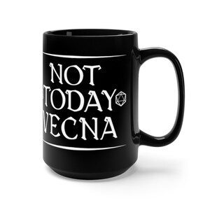 May include: Black ceramic mug with a white graphic that reads "NOT TODAY VECNA" and a Dungeons and Dragons dice symbol.