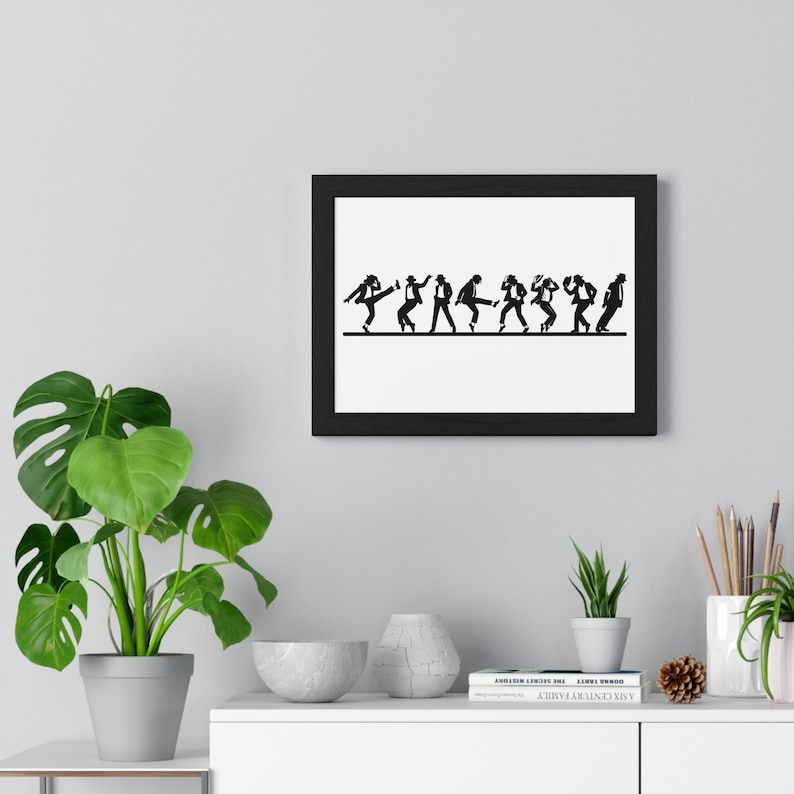 Puede incluir: Arte mural enmarcado en negro que presenta una silueta de un grupo de personas bailando en fila. Las figuras, vestidas con trajes y sombreros, realizan un baile sincronizado. La obra de arte est&aacute; sobre un fondo blanco.