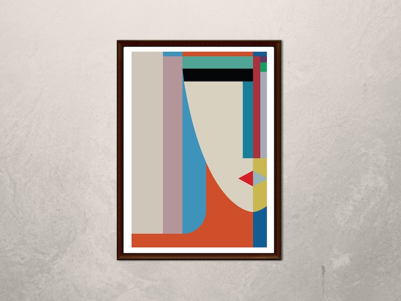 May include: Abstract geometric portrait art print in a brown frame. The print features a stylized face with a red, yellow, blue, and green color scheme.
