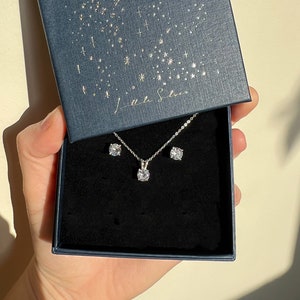 Matching silver necklace and earrings store