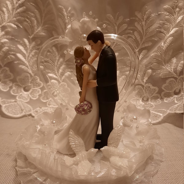 A Handmade New Beautiful Wedding Cake Topper Long Hair Bride and Handsome Groom.