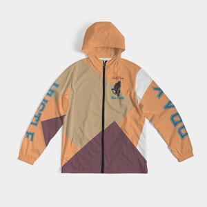 May include: A multi-coloured windbreaker jacket with a zip fastening. The jacket has a hood and features the words "First Pray Then Hustle" and a praying hands graphic on the front. The words "Pray" and "Hustle" are in blue text. The jacket has a geometric design with orange, white, brown, and purple sections.