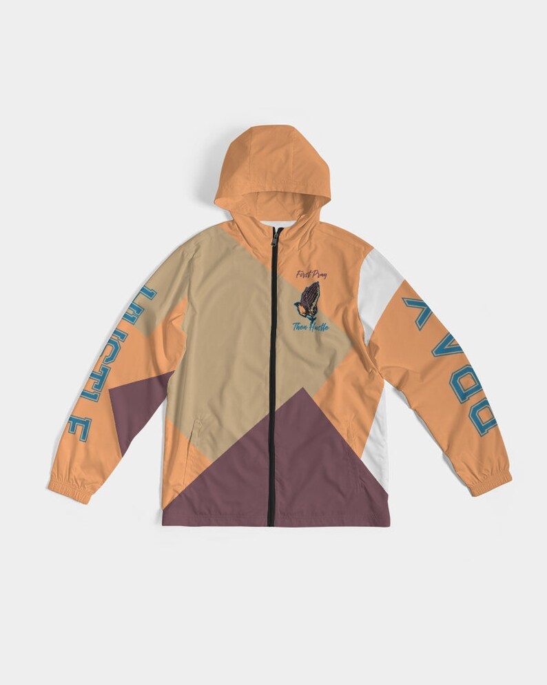 May include: A multi-coloured windbreaker jacket with a zip fastening. The jacket has a hood and features the words "First Pray Then Hustle" and a praying hands graphic on the front. The words "Pray" and "Hustle" are in blue text. The jacket has a geometric design with orange, white, brown, and purple sections.