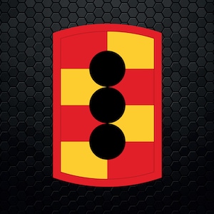 May include: A red and yellow patch with three black circles stacked vertically in the center. The patch has a rounded top and bottom.