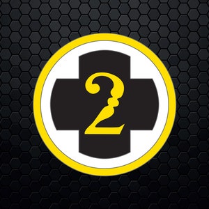 May include: A yellow circle with a white center and a black cross. The number "2" is written in yellow inside the cross.