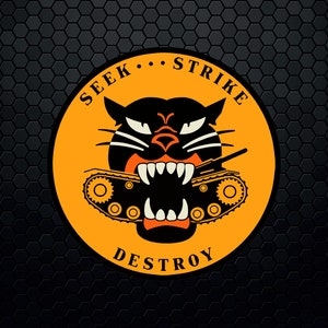 May include: A yellow circle with the words "Seek... Strike... Destroy" around the edge. Inside the circle is a black panther with a tank in its mouth.