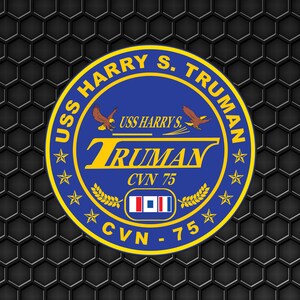 May include: A blue and gold circular emblem with the text "USS HARRY S. TRUMAN" and "CVN 75" surrounded by stars. The emblem features a stylized eagle and the text "TRUMAN" in a yellow banner.