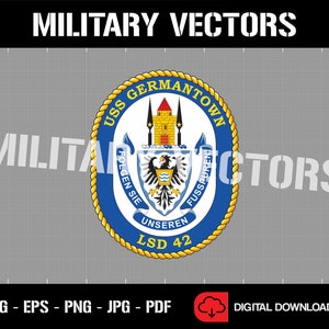May include: A blue and gold circular emblem with the text "USS GERMANTOWN LSD 42" and a coat of arms featuring a castle and a bird. The text "FOLGEN SIE UNSEREN FUSSPUREN!" is written around the coat of arms.