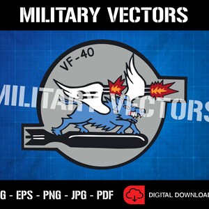May include: A gray circle with a blue winged creature with red flames coming from its wings. The creature is holding a bomb in its mouth. The text "VF-40" is written in black on the circle.