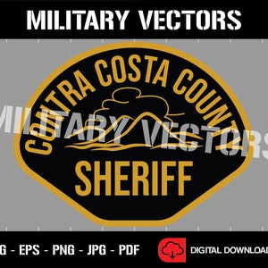 May include: A gold and black badge with the text "Contra Costa County Sheriff" in a rounded, hexagonal shape. The badge features a stylized mountain range and a cloud.