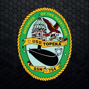 May include: A green and gold circular emblem with a rope border. The text "DEFENDER OF THE HEARTLAND" is written around the outside of the circle. Inside the circle is a submarine, a building, a bird, and the text "USS TOPEKA SSN 754".