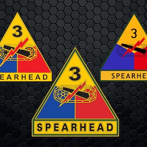 May include: A yellow triangle with a green border and the number 3 in the center. The triangle is divided into four sections: blue, red, yellow, and green. The blue section has a black lightning bolt and two crossed cannons. The text "SPEARHEAD" is below the triangle.