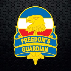 May include: A blue, red, and white circular emblem with a yellow eagle and sword. The text "FREEDOM'S GUARDIAN" is written on a blue ribbon.