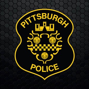 May include: A black and yellow badge with the words "PITTSBURGH POLICE" in a yellow outline. The badge features a stylized eagle and a checkered pattern.