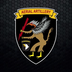 May include: A black and yellow shield with a white border. The shield features a griffin-like creature holding a lightning bolt. The text "AERIAL ARTILLERY" is above the creature and "AIRBORNE" is below.