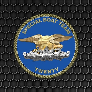May include: A circular emblem with a blue background, featuring a gold eagle with outstretched wings above a boat and the text "SPECIAL BOAT TEAM TWENTY". The emblem is surrounded by a gold rope border, set against a textured, dark gray background.
