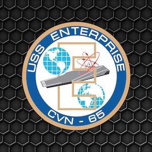 May include: A blue and gold circular emblem with the text "USS ENTERPRISE CVN - 65" and a stylised image of an aircraft carrier, an atom, and a globe.