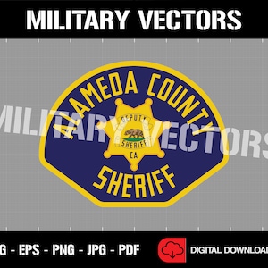 May include: A yellow and blue Alameda County Sheriff's badge with a gold star and the words "Alameda County Sheriff" in a yellow banner.