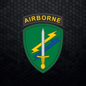 May include: A green and yellow military patch with the word "AIRBORNE" in black lettering. The patch features a silver sword with a yellow handle and two yellow lightning bolts.