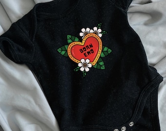 May include: Black baby onesie with a red heart graphic that says "Born Emo" in white text. The heart is surrounded by green leaves and white flowers.