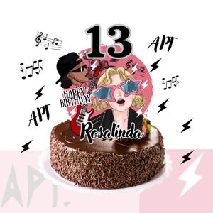 May include: A chocolate cake with chocolate sprinkles, topped with a decorative image featuring a cartoon of a woman wearing star-shaped glasses and a man with a guitar. The cake has the number 13 and the name Rosalinda.