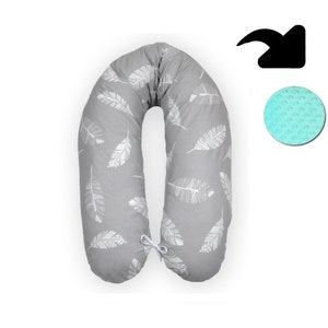 May include: A gray U-shaped pregnancy pillow with a white feather pattern. The pillow has a white tie at the center.
