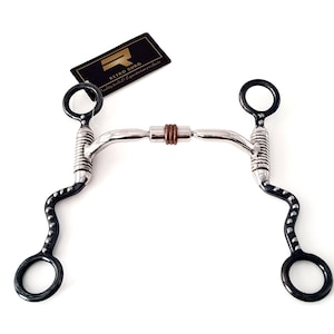 May include: A horse bit with a stainless steel and black finish. The bit has a curved design with a central joint and ring ends. The brand tag reads "Retro Surg quality tools & equestrian products."