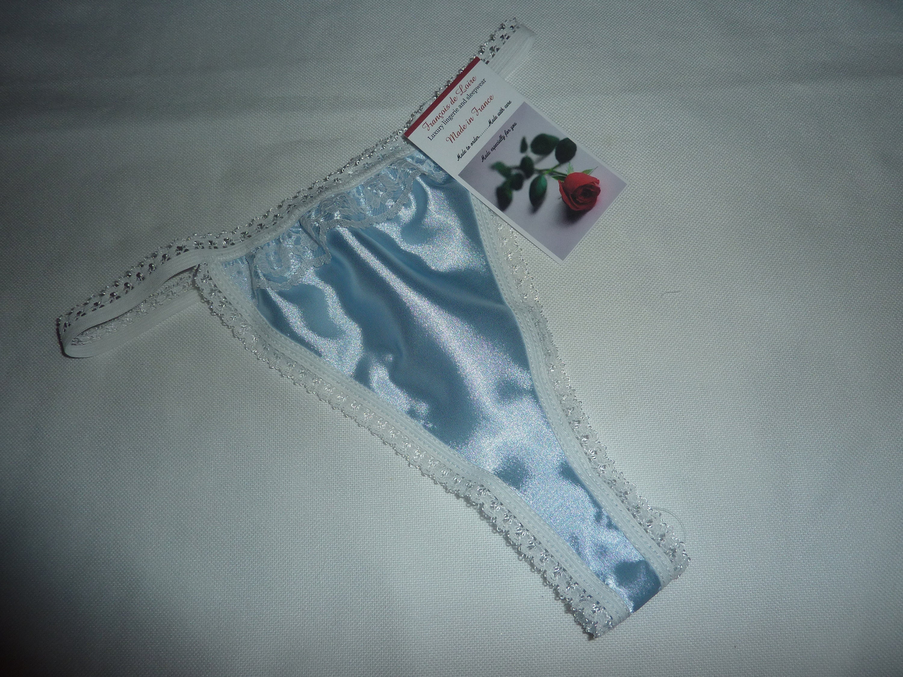 Pale Blue Shiny Satin Thong With Ivory Lace Trim. Cheeky Skimpy