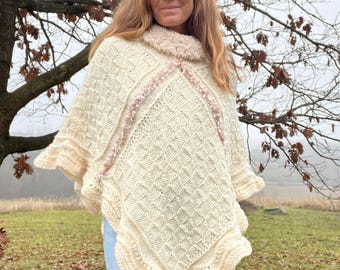Hand-knitted poncho with a cozy collar