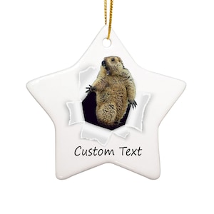 May include: White ceramic star-shaped Christmas ornament with a marmot peeking out of a torn hole in the paper. The ornament has the text "Custom Text" printed on it.