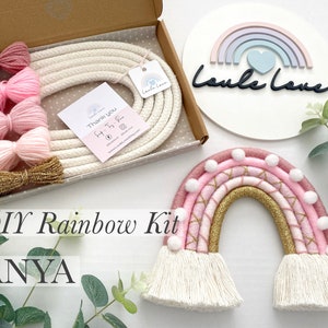 May include: DIY rainbow kit with pink, gold and white yarn, a white rope and a wooden sign that says "Loulè Love".