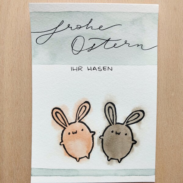 Osterkarte - Frohe Ostern, ihr Hasen! - zwei gestempelte Osterhasen - Aquarell - Brauntöne - schwarzes Lettering - handgemacht - Unikat