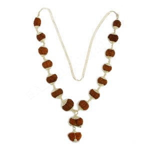 May include: A silver necklace with brown, textured beads. The beads are connected by silver chain links. The necklace includes a pendant with a similar bead design. The necklace is shown against a white background.