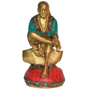 Brass Sitting Sai Baba statue with stone work