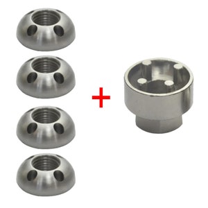 May include: Set of four silver wheel lug nuts with a unique design and a matching silver lug nut tool.