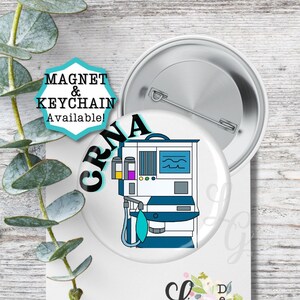May include: A white button with a blue and white illustration of a medical machine with the text "CRNA" in a blue circle. The text "MAGNET & KEYCHAIN Available!" is on a separate blue circle.