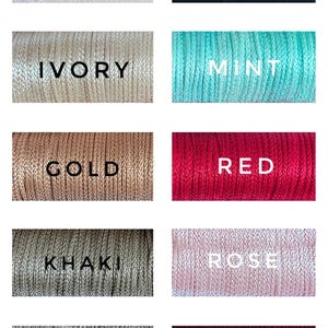 May include: A collection of 10 spools of embroidery floss in various colors, including white, black, ivory, mint, gold, red, khaki, rose, silver, and sangria.