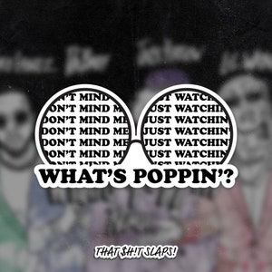 May include: A sticker featuring a pair of white sunglasses with the words "DON'T MIND ME" and "JUST WATCHIN" inside the lenses. Below the glasses is the phrase "WHAT'S POPPIN'?" and the text "THAT $HIT SLAPS!" at the bottom.