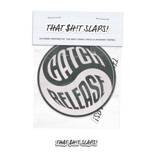 May include: Two black and white stickers with the text "Catch Release" and "Isol" in a yin yang design. The stickers are packaged in a clear plastic bag with the text "That Sh!t Slaps!" printed on the bag.