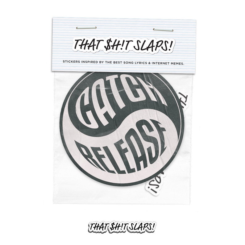 May include: Two black and white stickers with the text "Catch Release" and "Isol" in a yin yang design. The stickers are packaged in a clear plastic bag with the text "That Sh!t Slaps!" printed on the bag.